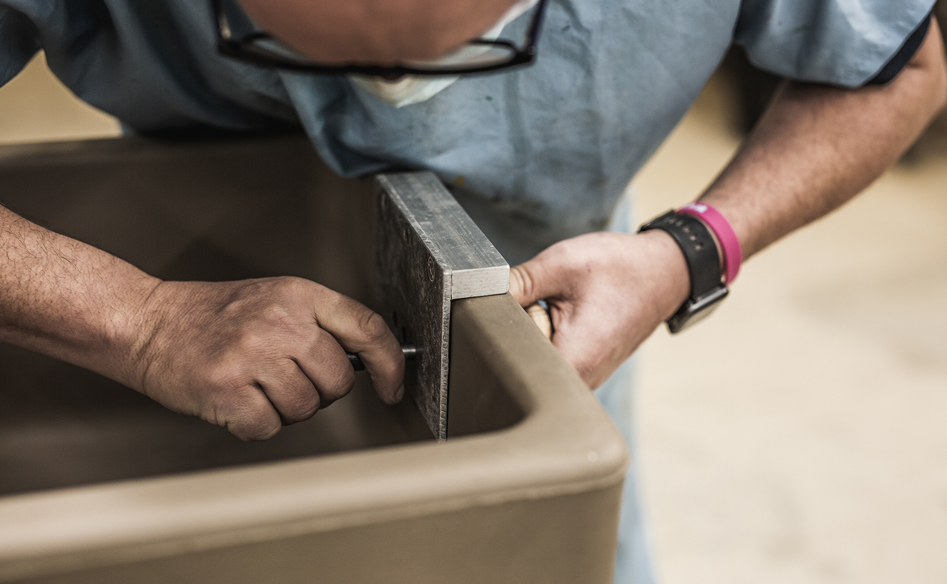 Then the maker stamps their name, and the year of production, and the sink is then dried at 110°C for two days.